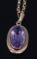 Lot 2293 - A modern 9ct gold and oval cut amethyst set...