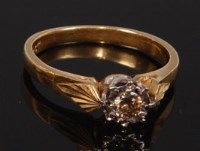 Lot 2302 - An 18ct gold diamond solitaire ring, the...