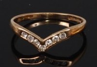 Lot 2308 - A 9ct gold diamond set wishbone ring, having...