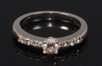 Lot 2310 - A modern platinum and diamond set dress ring,...