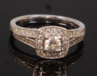 Lot 2325 - An 18ct gold diamond cluster ring, arranged as...