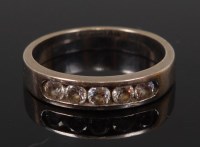 Lot 2326 - An 18ct white gold diamond set half hoop ring,...