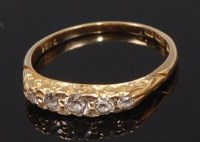 Lot 2333 - An 18ct gold diamond five stone ring, the...