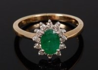 Lot 2131 - A 9ct gold, emerald and diamond dress ring,...