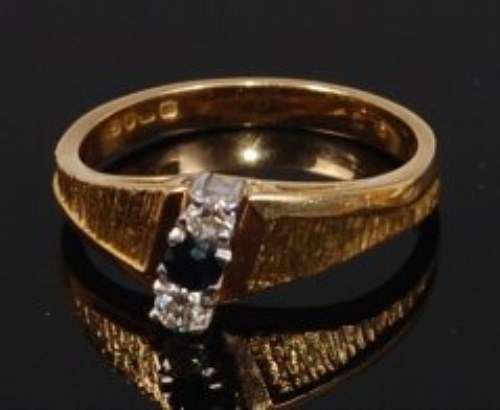 Lot 2269 - A modern 18ct gold, sapphire and diamond ring,...