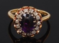 Lot 2335 - An 18ct gold, amethyst and diamond set cluster...