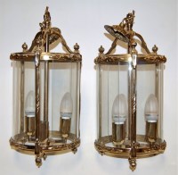 Lot 71 - A pair of modern brass framed glass...