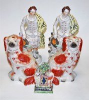 Lot 107 - A pair of Victorian seated Staffordshire...