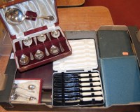 Lot 222 - A box of miscellaneous cased silver plated...