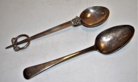Lot 277 - A George III silver serving spoon; together...
