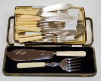 Lot 230 - A cased pair of silver plated fish servers...