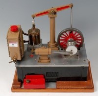 Lot 38 - A wooden cased model of a beam engine powered...