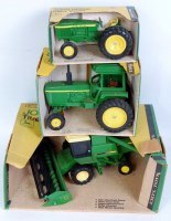 Lot 1209 - Three boxed ERTL large heavy pressed steel and...
