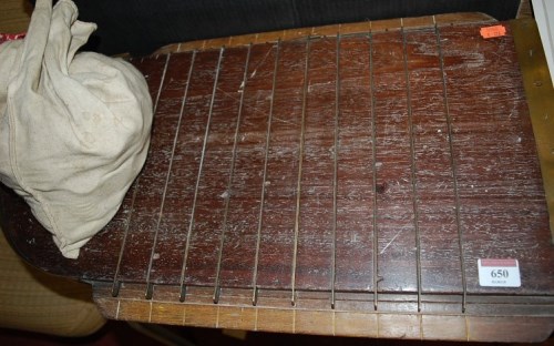 Lot 650 - An early 20th century shove ha'penny board,...