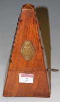 Lot 2 - An early 20th century walnut cased metronome...