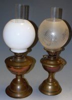 Lot 7 - Two early 20th century brass oil lamps with...