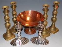 Lot 12 - A pair of silver plated candlesticks raised on...