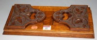 Lot 40 - An early 20th century carved oak bookslide...