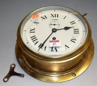 Lot 47 - A circular brass cased ships clock, having...