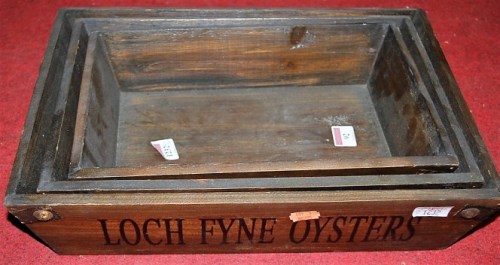 Lot 92 - A graduated set of three stained wood and...