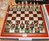 Lot 138 - A contemporary figural chess set with board,...