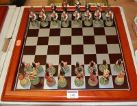 Lot 140 - A contemporary figural chess set with board,...