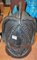 Lot 147 - A stained and carved wood tribal mask, height...