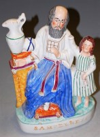 Lot 39 - A Victorian Staffordshire pottery figure...