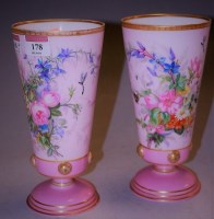 Lot 178 - A pair of Victorian floral painted pink glass...