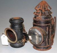 Lot 209 - Two early 20th century black painted miners lamps