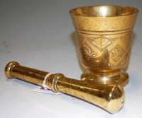 Lot 286 - A heavy brass engraved pestle & mortar