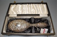Lot 253 - A Victorian embossed silver hand brush housed...