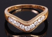 Lot 2022 - A modern 9ct gold diamond set wish bone ring,...