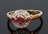 Lot 2054 - A 9ct gold, ruby and diamond cluster ring...