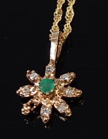 Lot 2230 - A 9ct gold, emerald and diamond point set...