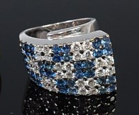 Lot 2237 - A high carat white gold, sapphire and diamond...