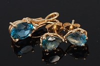 Lot 2070 - A pair of modern 14ct gold blue topaz set ear...
