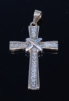 Lot 2106 - A 9ct gold and diamond set cross pendant,...