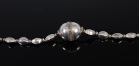 Lot 2252 - An Eastern white metal necklace, having centre...