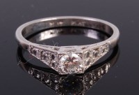 Lot 2254 - A platinum diamond solitaire ring, the four...