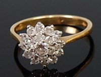 Lot 2255 - An 18ct gold diamond flower head cluster ring,...