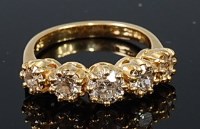 Lot 2272 - An 18ct gold diamond five stone ring, the...