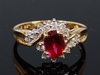 Lot 2273 - An 18ct gold, ruby and diamond dress ring, the...