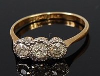 Lot 2301 - An 18ct gold and platinum diamond three stone...