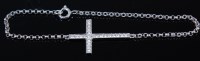 Lot 2315 - An 18ct white gold and diamond cross set...