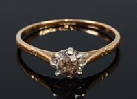 Lot 2318 - An 18ct gold diamond solitaire ring, the claw...