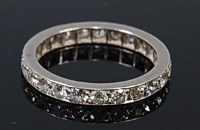 Lot 2319 - A platinum diamond eternity ring, set with 23...