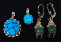 Lot 2323 - A pair of 9ct gold and cabochon jade set ear...