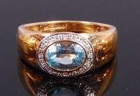 Lot 2327 - An 18ct gold, blue topaz and diamond point set...