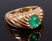 Lot 2340 - A 1940s 18ct gold and cabochon emerald set...